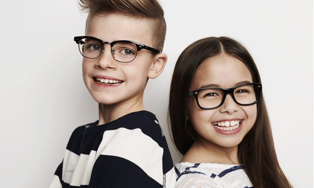 a young boy and girl with eye glasses