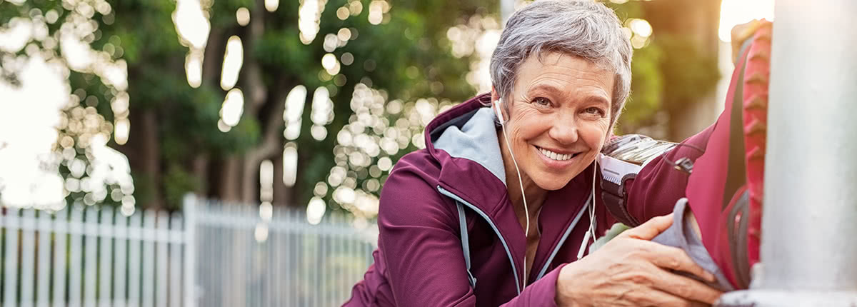 active lady with earphones smiling