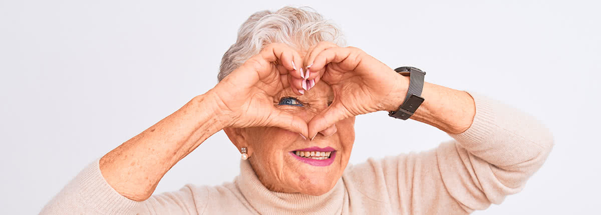 Senior grey-haired woman wearing turtleneck sweater standing over isolated white background