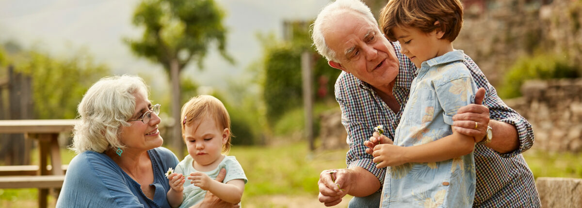 Senior male and female with two children