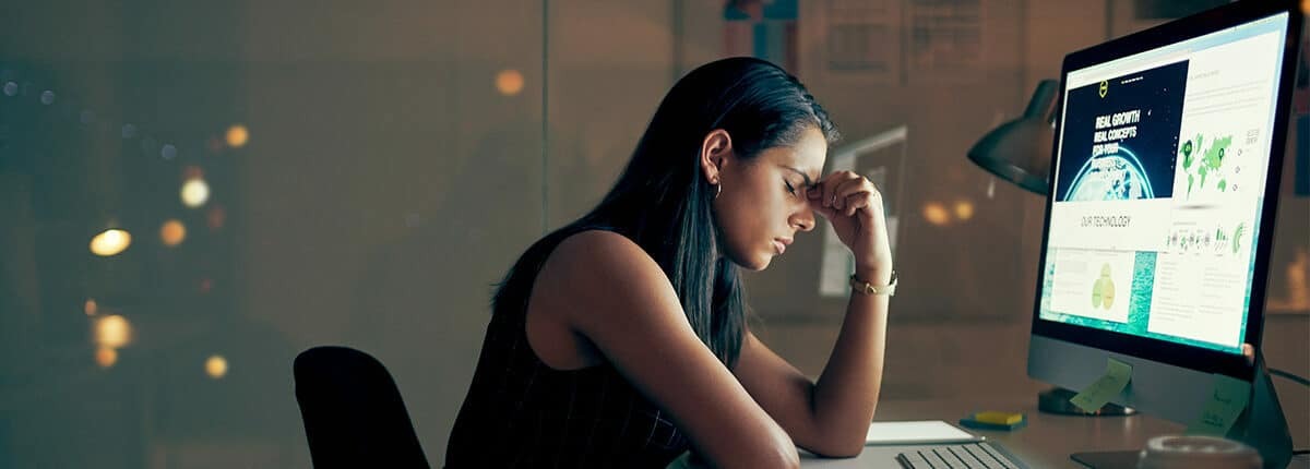 woman with eyestrain sitting at computer