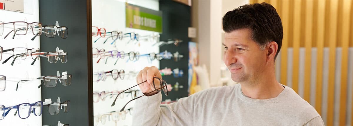 eyecare-plus-optometrist-man-trying-frames